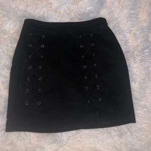 Black tight criss cross skirt with slits